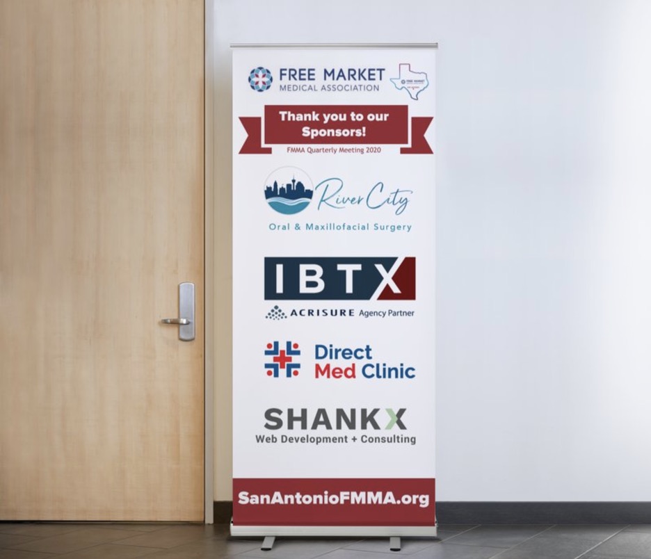 San Antonio Free Market Medical Association banner next to doorway with Gold Sponsors River City Oral and Maxillofacial Surgery, IBTX Acrisure Agency Partner, Direct Med Clinic, Shankx Web Development and Consulting